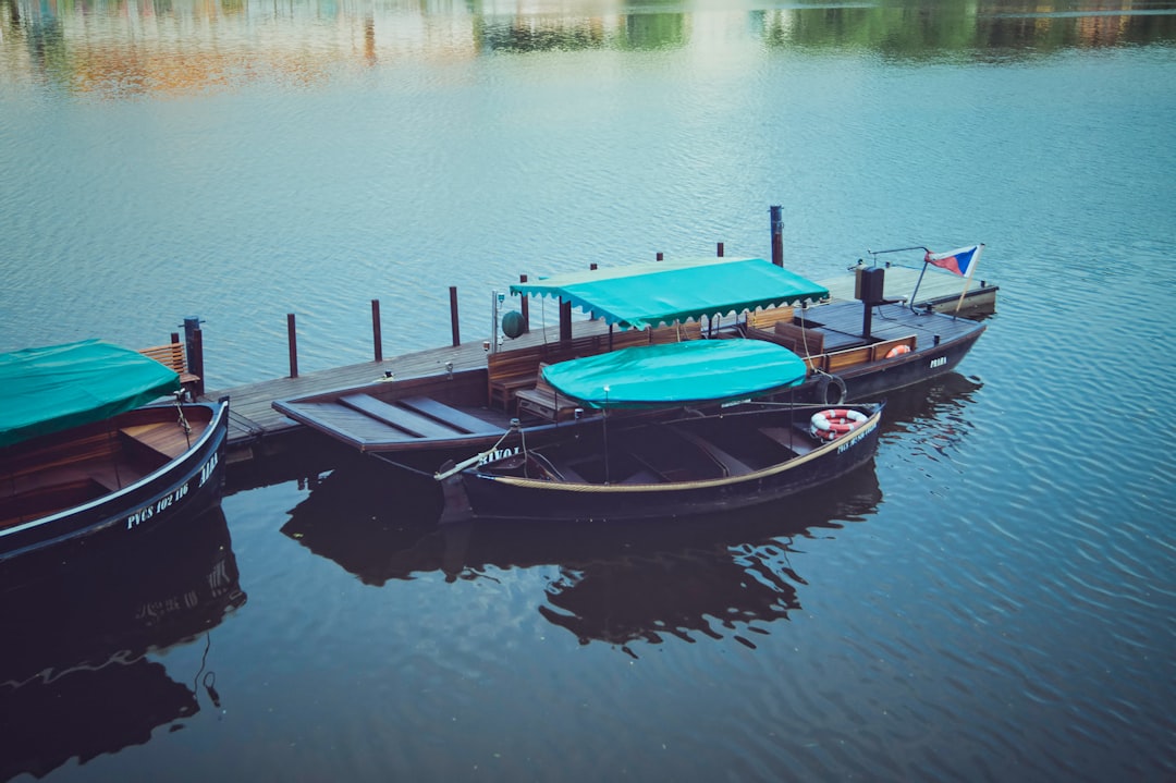 parked blue outboard boat,