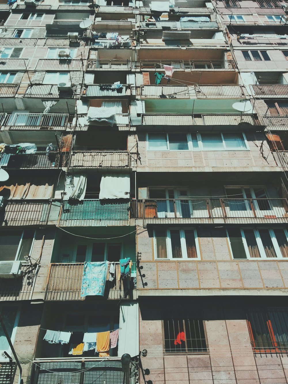 a tall building with lots of windows and balconies