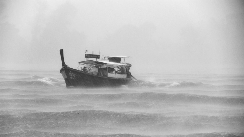 grayscaled photo of boat