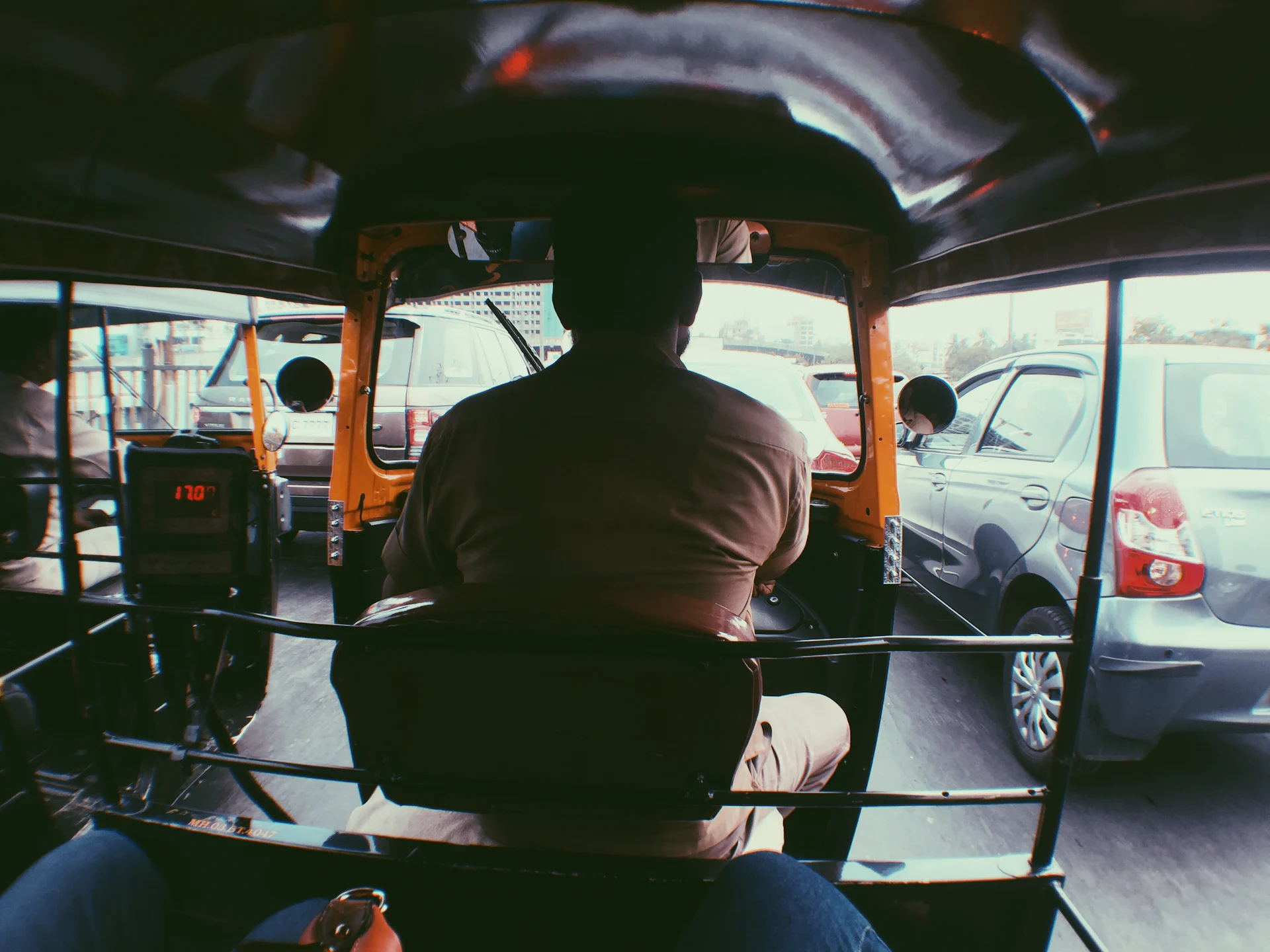 Driver at the wheel of a car on an Indian road