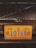 A close-up of a vehicle's front grill with a prominent yellow and blue license plate from Grand Bahama. The license plate has the number 10768 and includes the years 1492 and 1992 with emblems on either side.