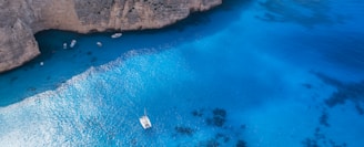 boat on body of water in aerial photography