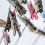 shallow focus photography of brown clothes pins