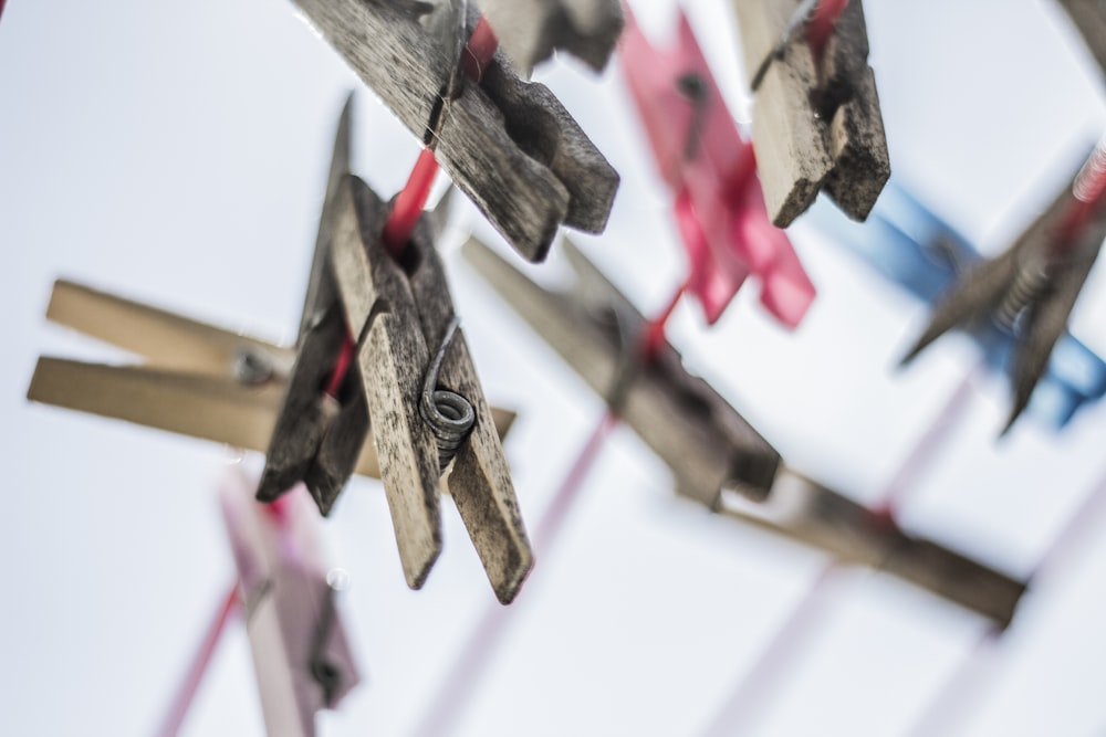 shallow focus photography of brown clothes pins