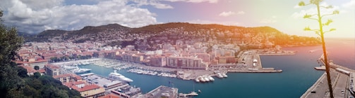 A panoramic view of Surf City harbor filled with various boats and yachts on a sunny day.