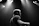 A candid photo of Brendon mid-performance, spotlight highlighting his classic Elvis style.