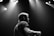 A professional photographer capturing a musician performing in a beautifully lit studio.