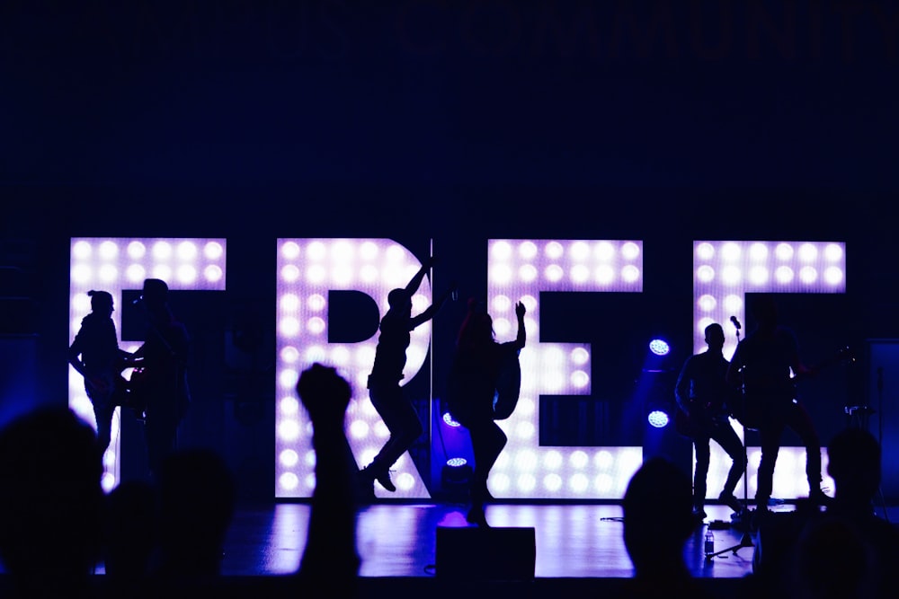 silhouette of people with free marquee letters