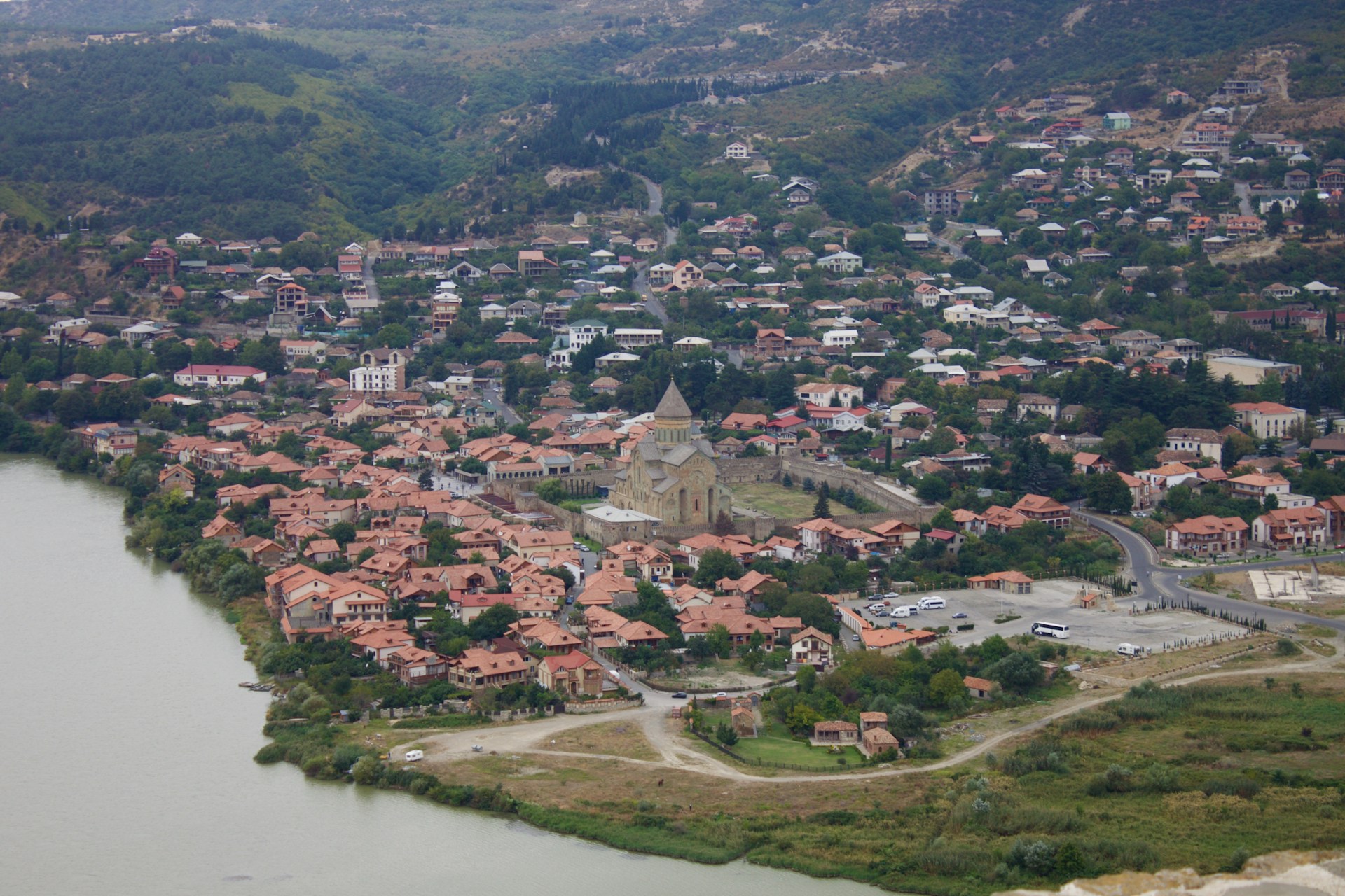 woman wearing yellow long-sleeved dress under white clouds and blue sky during daytime