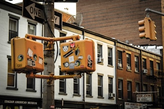 Annotated photo with multiple colored bounding boxes highlighting various objects in a street scene.