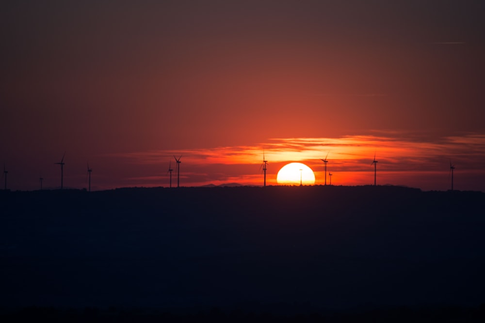 silhouette of electric windmills