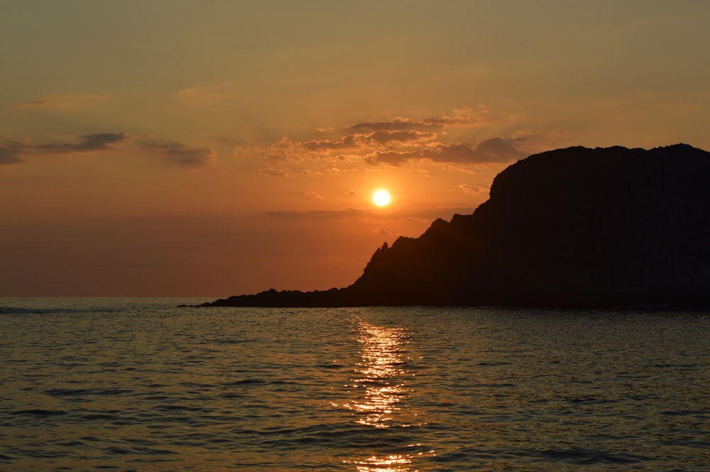 silhouette of mountain during sunset