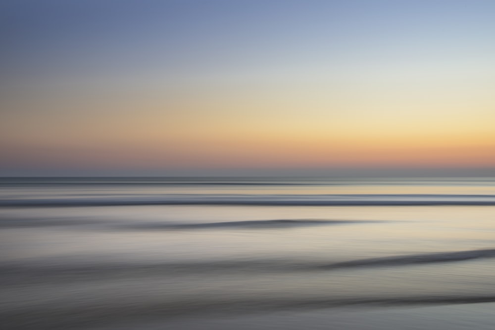 calm sea under golden clouds