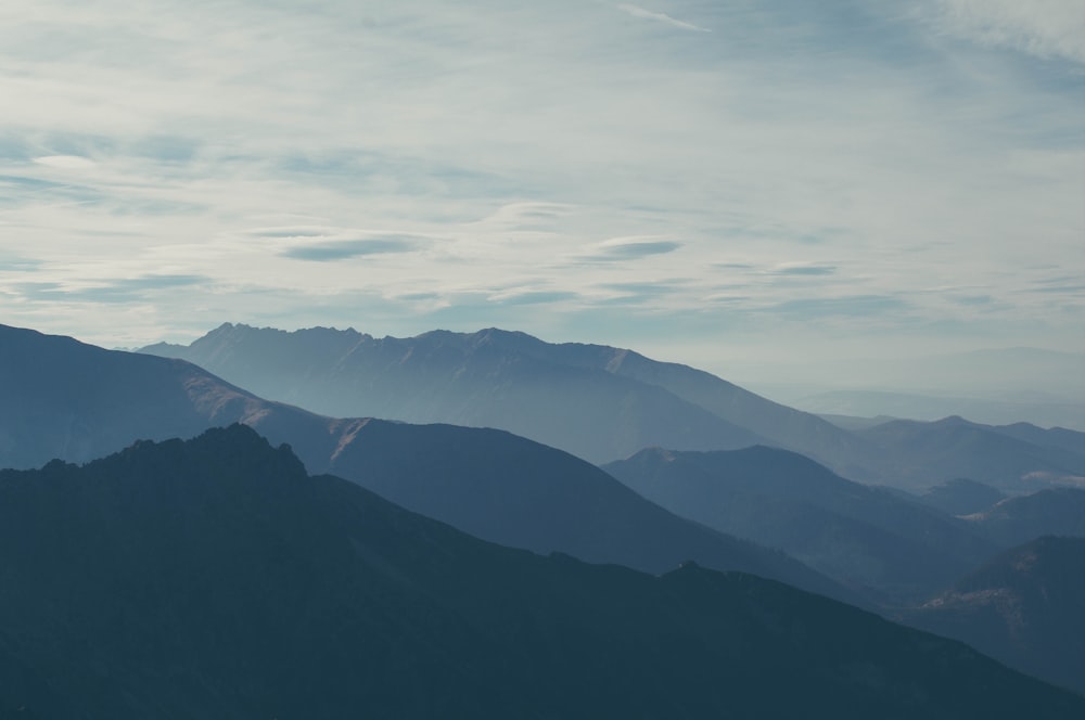 silhouette of mountains covered with fog