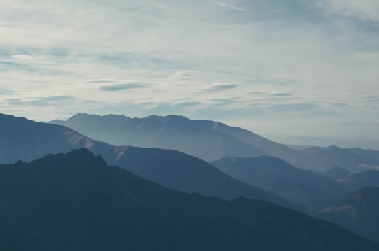 silhouette of mountains covered with fog in Wysokie Tatry Slovakia