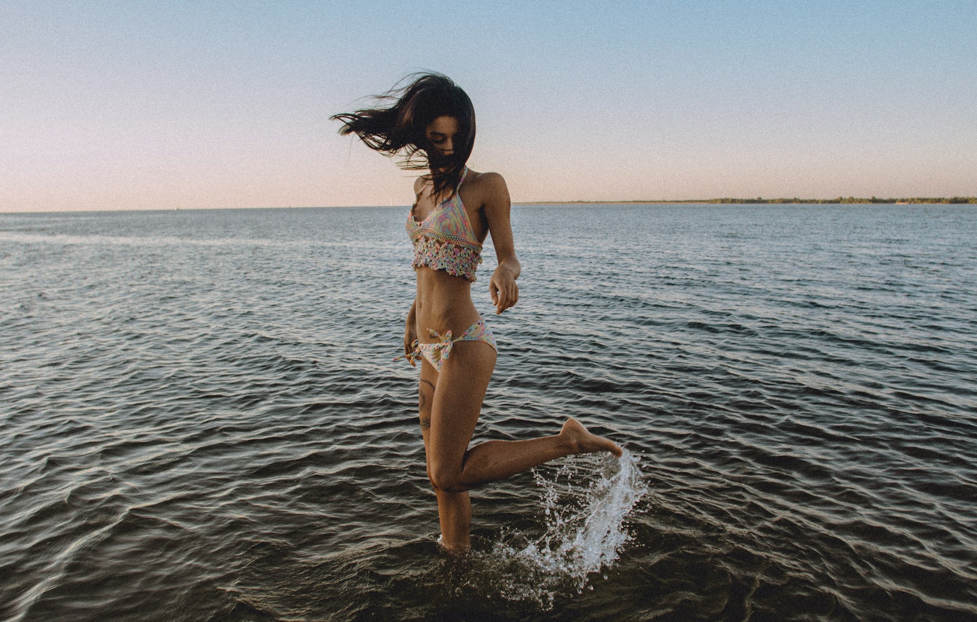 Woman splashing water at beach