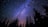 worm's eye view of trees during night time