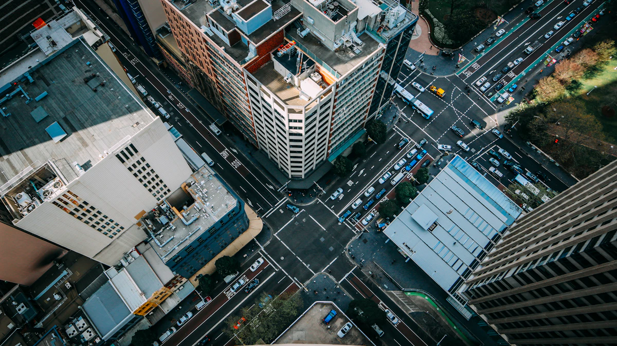 Aerial view of a busy city intersection surrounded by office towers