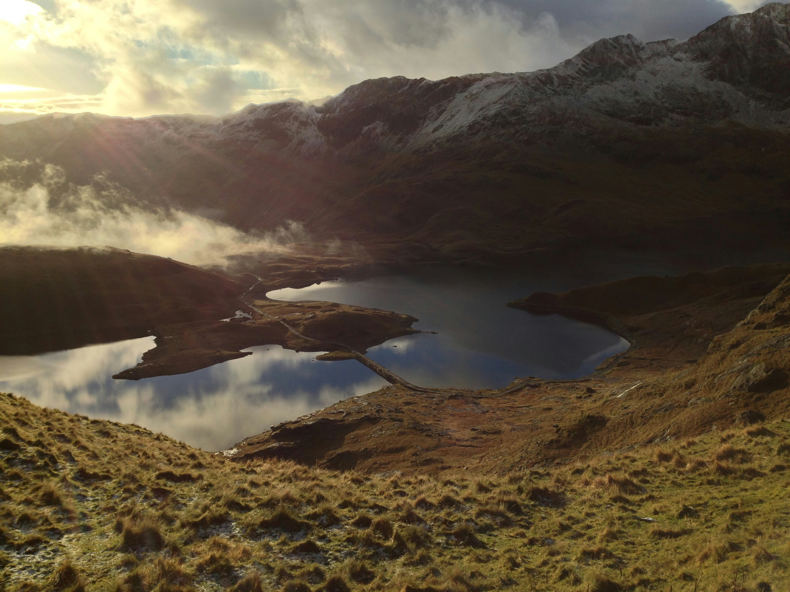 photo of body of water surrounded with rock formations, Snowdonia mountain river