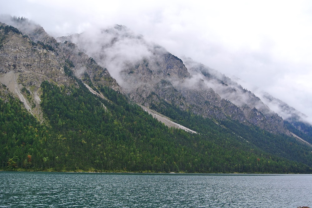 green and gray mountains under white cloudy sky