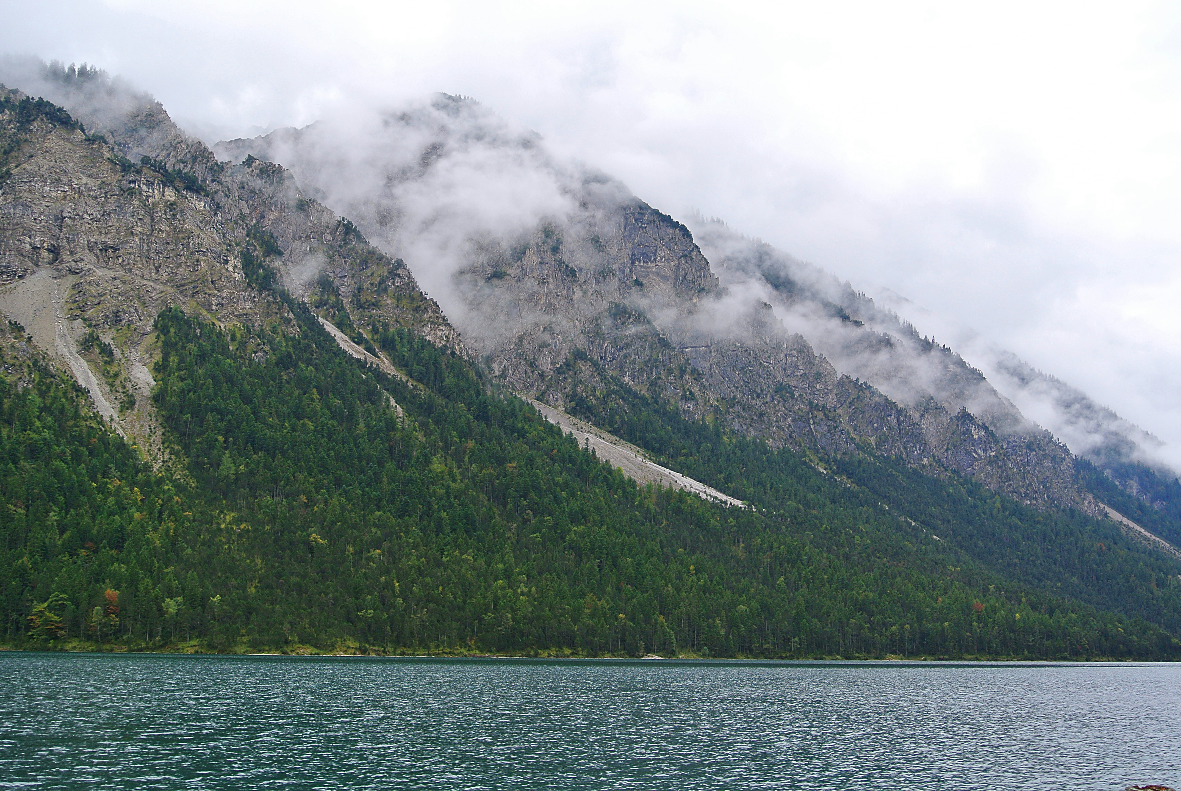 green and gray mountains under white cloudy sky