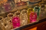 A beautifully arranged display of ghee jars in various sizes.