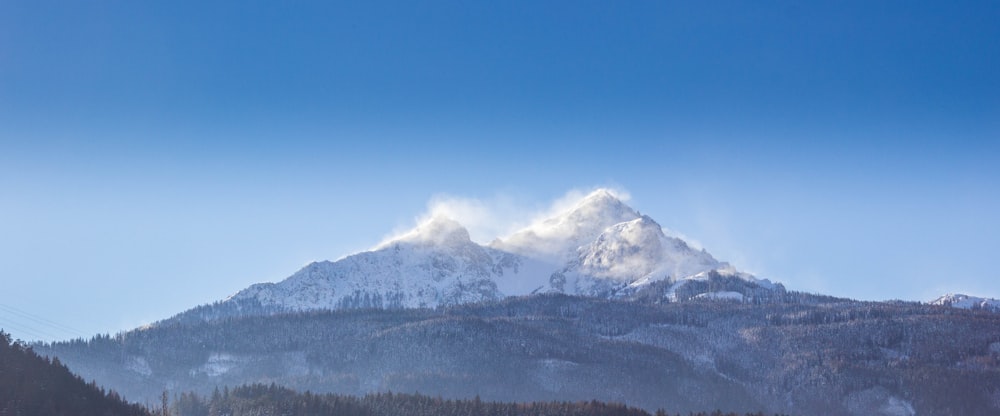 white and brown mountain under clear blue sky