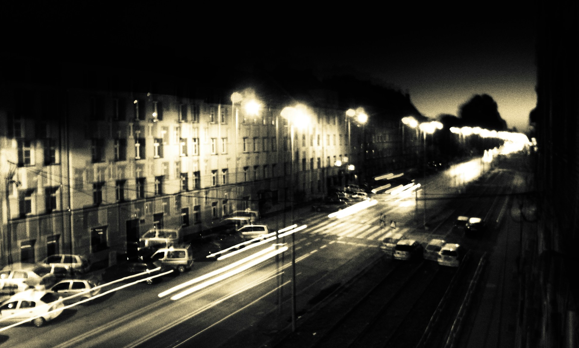 An atmospheric nighttime scene featuring Lagos logistics in motion, with blurred lights and a hint of the signature half-white beard logo subtly integrated.