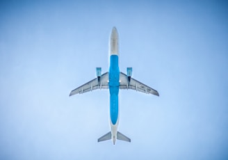 low angle photography of blue commercial airplane