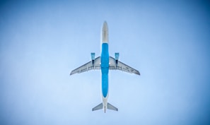 low angle photography of blue commercial airplane