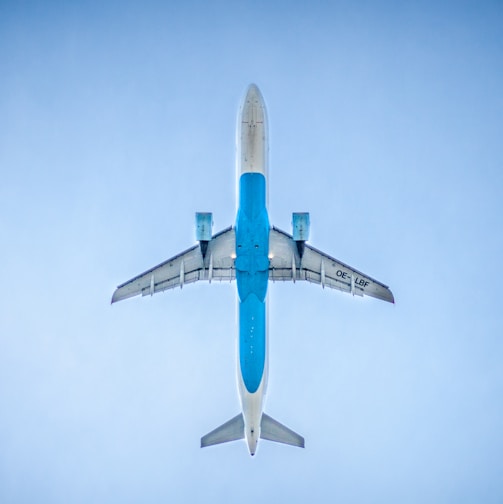 low angle photography of blue commercial airplane