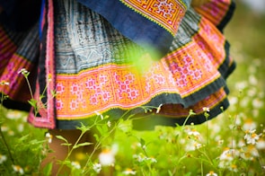 A vibrant assortment of colorful skirts laid out on a table.