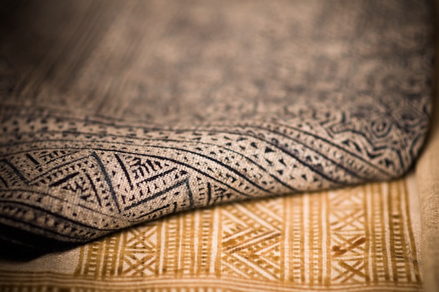 A close up that shows the texture of two different patterned rugs