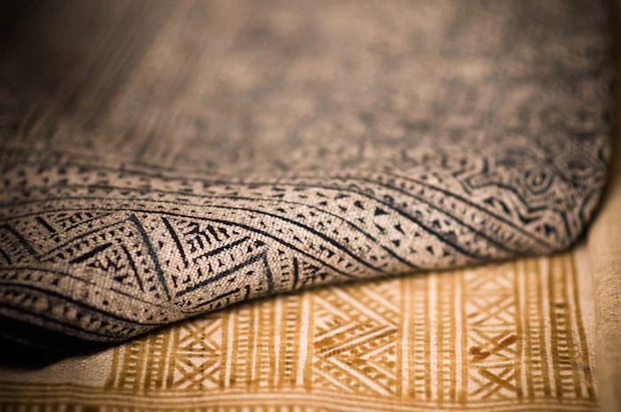 Close up texture of traditional patterned batik fabric in earth tones