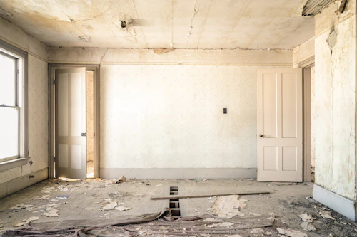 Bare concrete walls before interior renovation