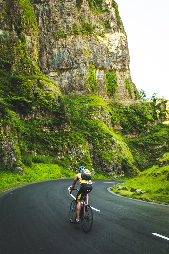 person riding a mountain bike in Cheddar Gorge United Kingdom