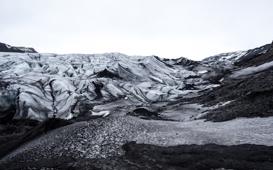 grayscale photo of mountains in Sólheimajökull Iceland