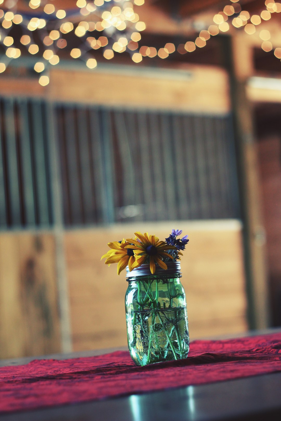 clear glass mason jar on pink textile