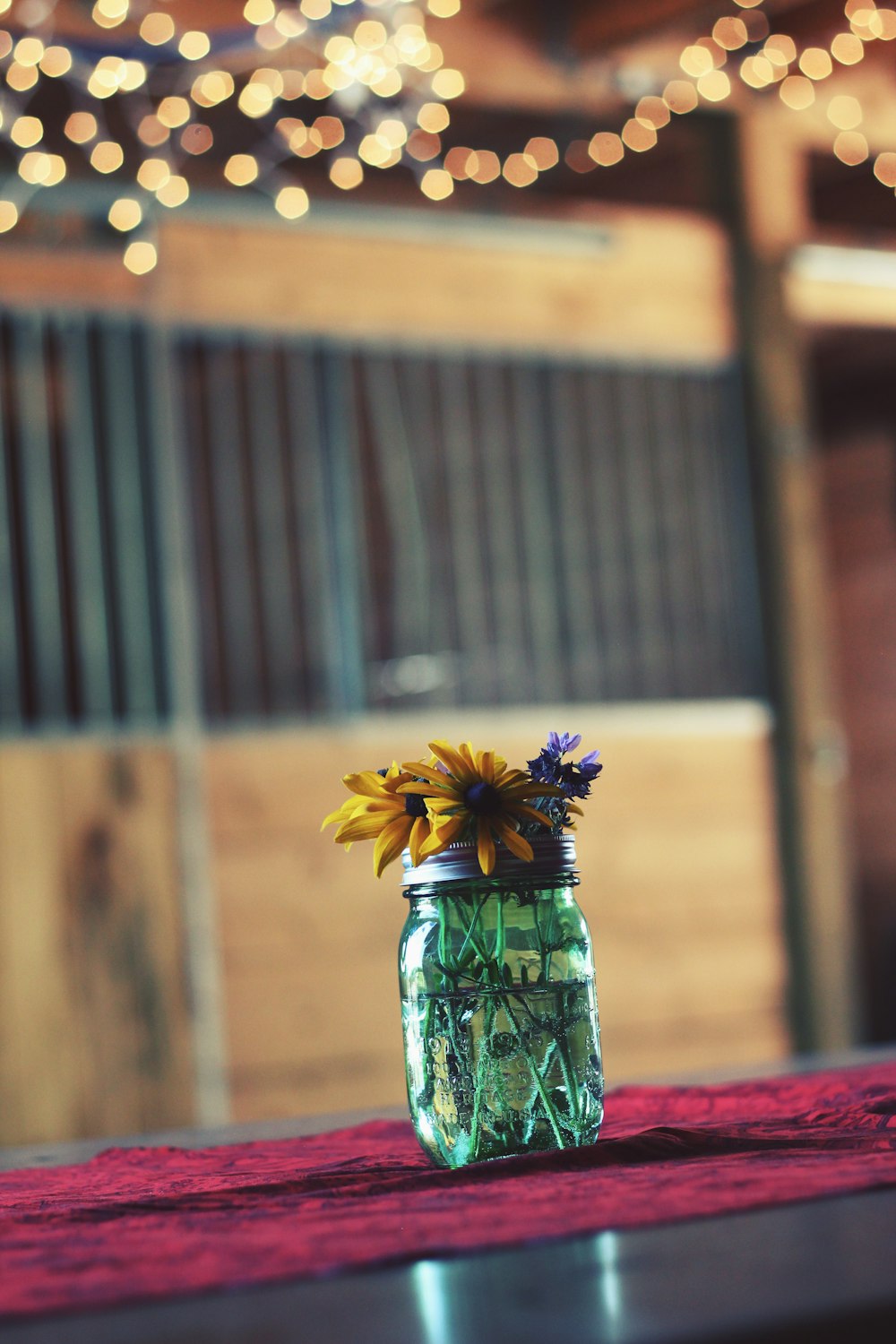 clear glass mason jar on pink textile