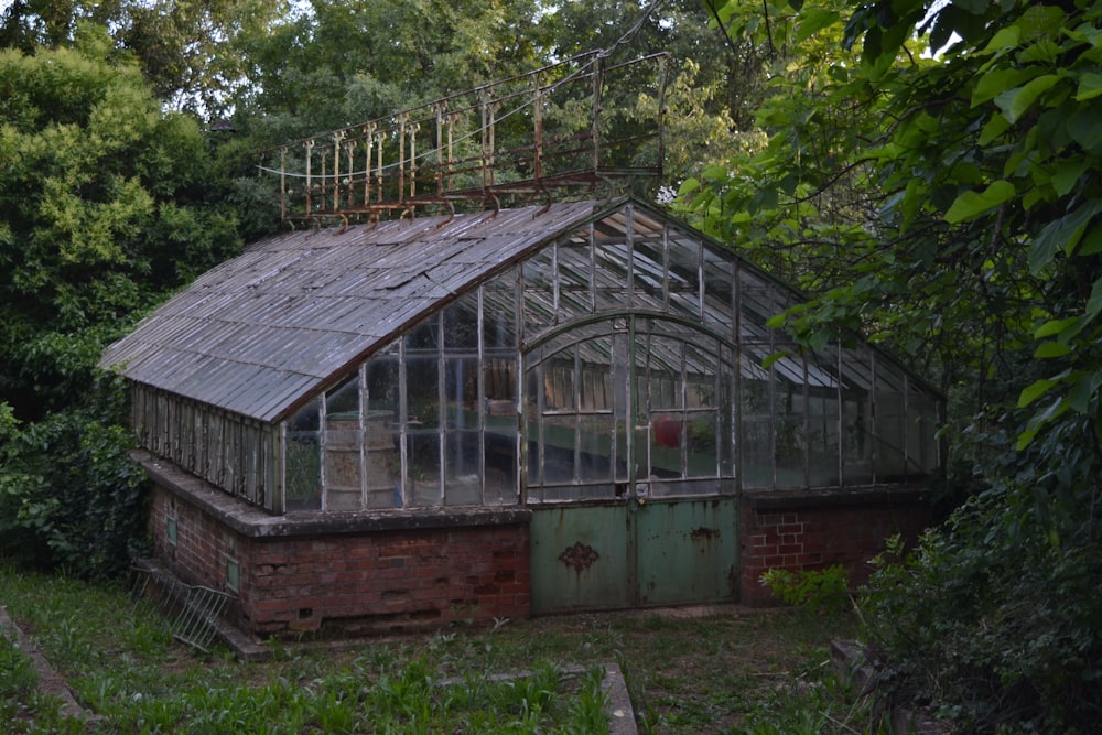 A garden building surrounded by trees.