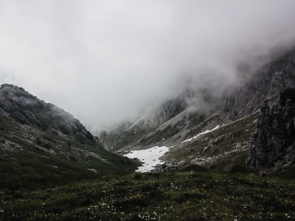 aerial photography of mountains with fogs