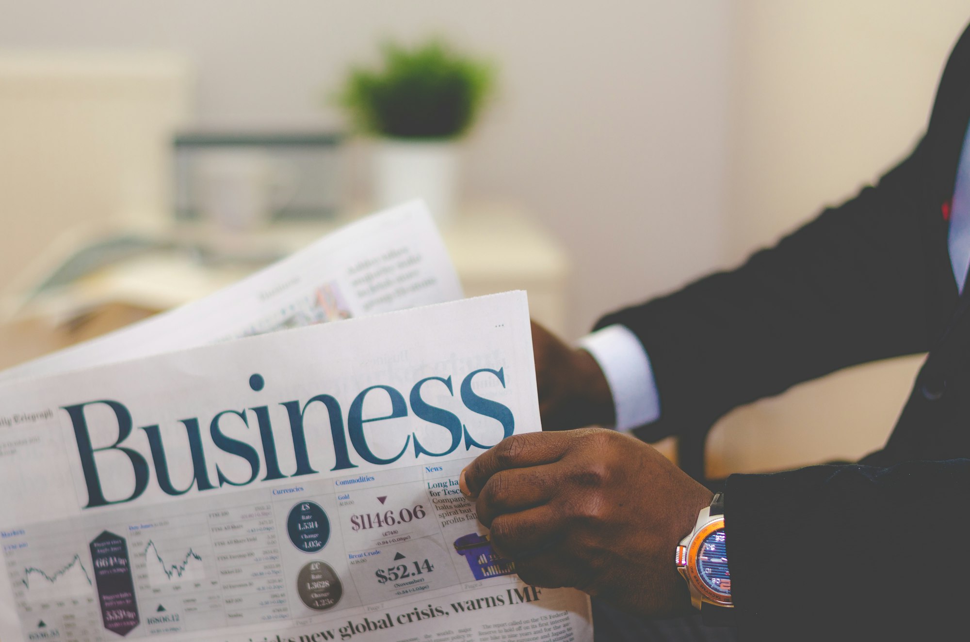 Businessman opening a paper