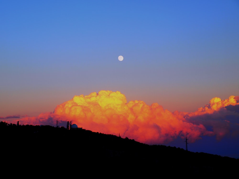 white clouds near mountain