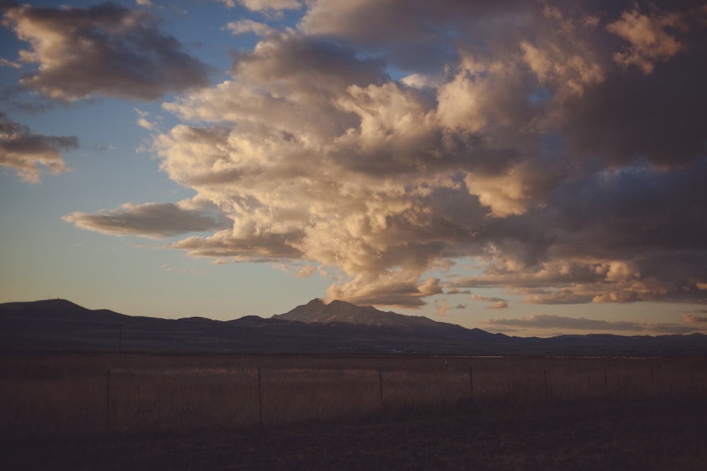 mountain under white and gray skies