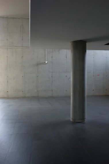 High-quality photo of a polished concrete industrial floor inside a spacious warehouse with modern lighting.