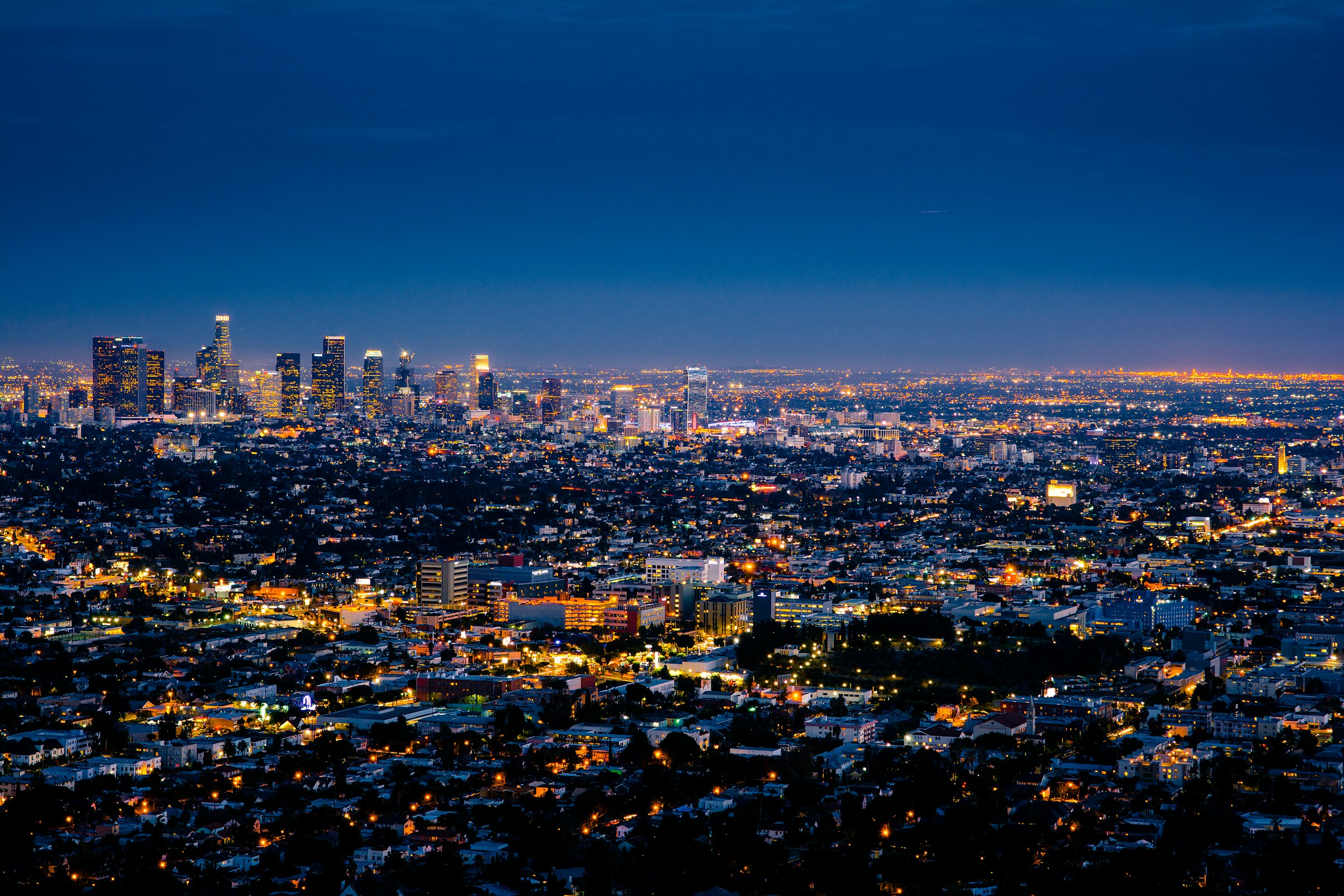 A city skyline and bay at golden hour
