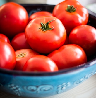 a bowl of red tomatoes