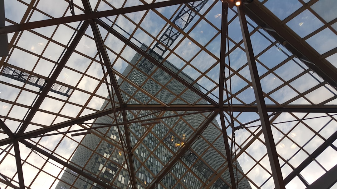 low angle photography of building, Window pane designs
