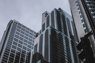 three tall buildings during daytime