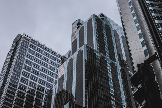 three tall buildings during daytime